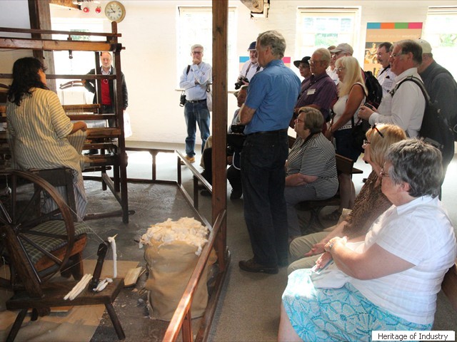 Newcomen members enjoy a demonstration of hand weaving